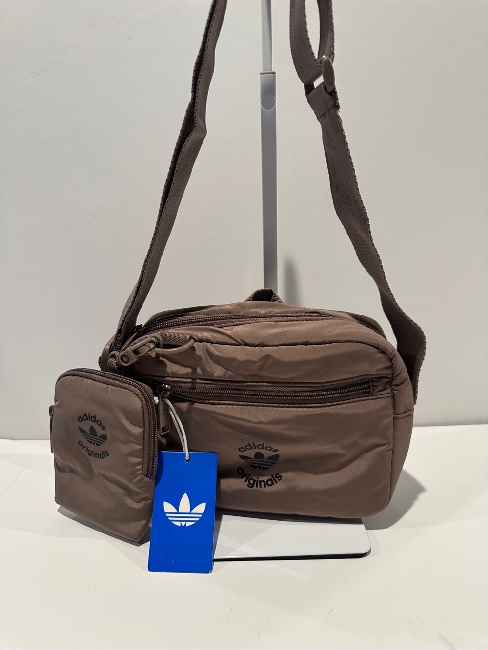 NWT Adidas Taupe Puffer and Pouch Crossbody Bag with inside zipper pocket.